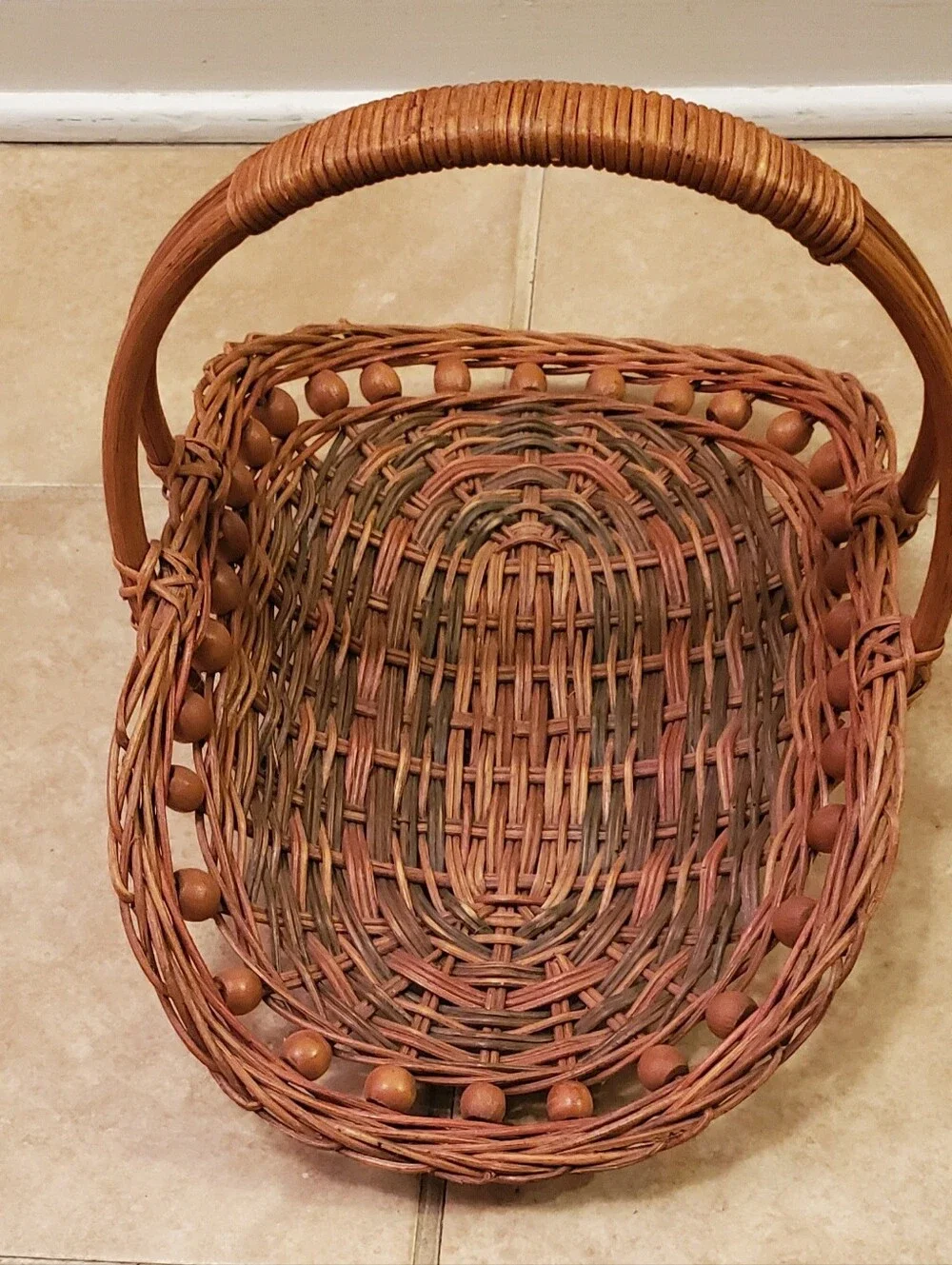 VTG. Handwoven Rattan Gathering Basket with Wood Bead Trim & Arched Handle.